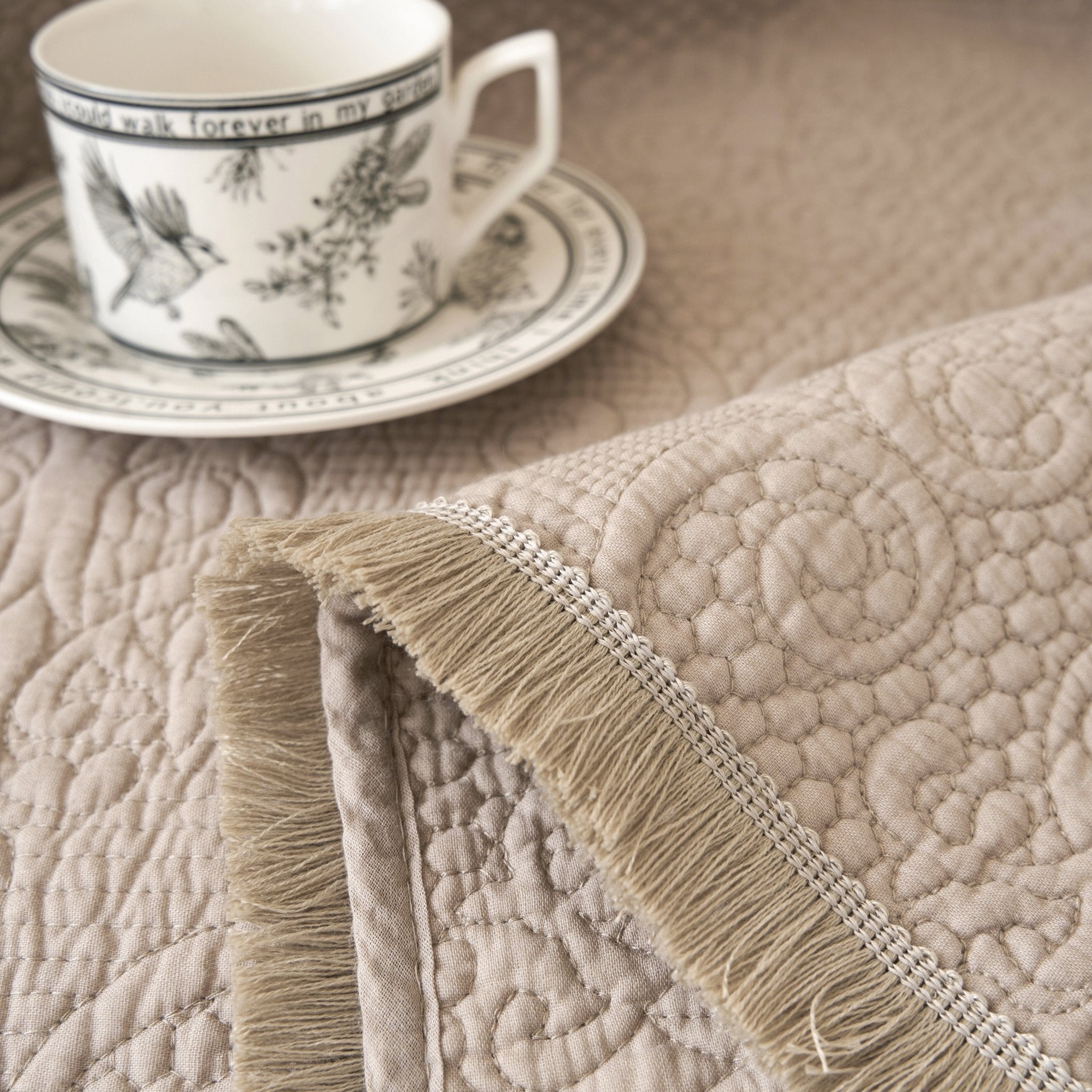 DaDa Bedding Elegant Fringed Cotton Quilted Throw Blanket - Luxurious Solid Soft Paisley Pattern, Cozy Lightweight Lap Throw, Perfect for Couch or Bed, Neutral Sandy Taupe Tan Beige, 50x60 Inches - Rustic Avenue